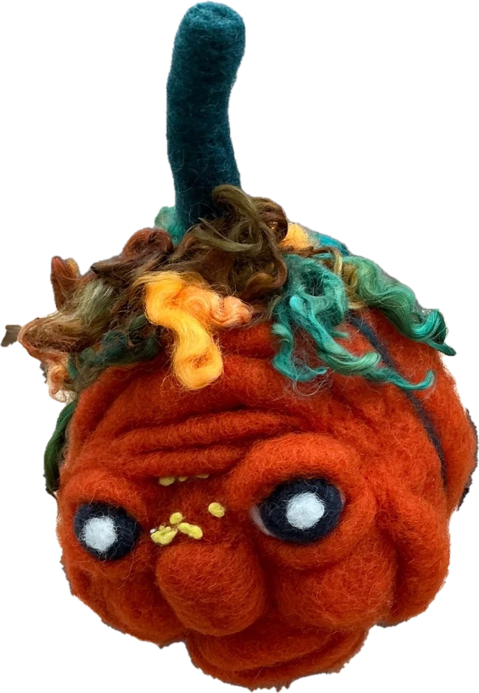 A needle-felted grumpy pumpkin with a dark green stem and curly orange, green, and brown wool locks